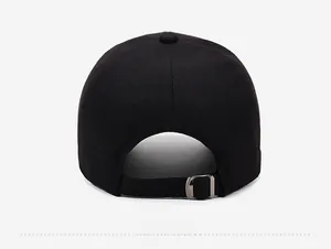 Detail of adjustable metal slider buckle on the back of a black cotton baseball cap