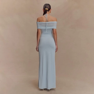 Detail of light blue halter dress with elegant mesh pleats and open back design