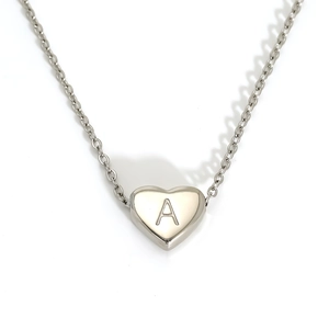 Polished stainless steel heart pendant necklace with engraved letter A on white background