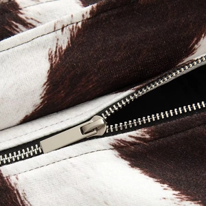 Women's autumn jacket with cow print faux fur and premium silver metal zipper detail