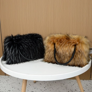 Faux fur tote bags in black and brown colors shown on a minimalist white table