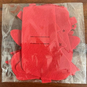 Bulk set of red felt Christmas silhouette decorations including trees and socks in packaging