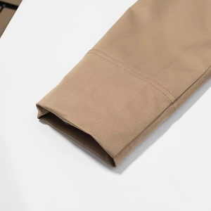 Winter sweet style loose brown trench coat featuring tied bow cuffs and refined stitching