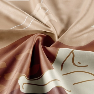Macro detail of Bohemian silk scarf showing abstract earthy art prints and satin texture