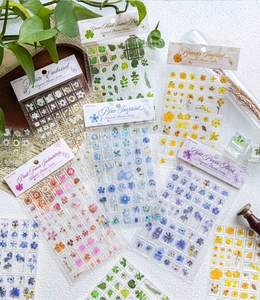 Detailed view of 3D acrylic natural plant stickers in multiple colors for DIY phone cases