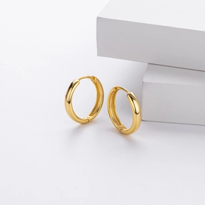 Macro shot of S925 hallmark on gold plated sterling silver hollow hoop earrings