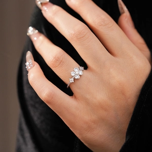 Detailed view of zircon flower ring with heart-shaped crystals and fine pavé setting