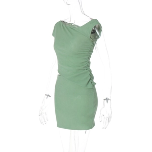 Detail of the green sleeveless bodycon dress with ruching side seam and slim fit cut