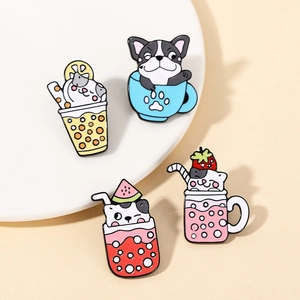 Detailed view of four cute enamel pins featuring cats and dogs in colorful drink cups