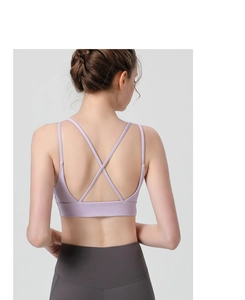 Detail of lavender sports bra with cross-back strap design and wide supportive underband