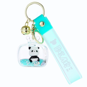 Acrylic floating panda keychain with turquoise strap, liquid glitter, and a small bell charm