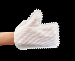 Macro shot of white non-woven cleaning glove with textured surface for household dusting