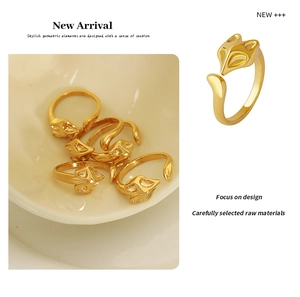 Detailed close-up of a polished gold fox-shaped open ring with abstract creative design