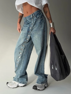 Retro washed light blue wide leg jeans with unique diagonal multi-button fly design