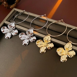 Polished gold and silver 3D flower charm hoop earrings with metallic petals
