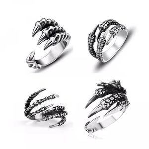 Detail shots of four vintage punk dragon claw adjustable open rings in silver finish