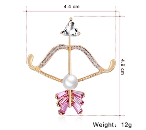 Detail of Cupid's arrow brooch with pink crystals and pearl, 4.4cm x 4.9cm size view