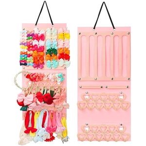 Dual-sided pink felt organizer for hair accessories showing storage capacity and structure