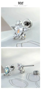Detail of star-shaped zircon ear studs with screw back design in various colors