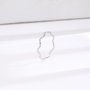 Minimalist silver wavy hammered titanium steel ring with unique textured surface