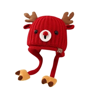 Cute red knit baby reindeer hat with earflaps and antlers for winter warmth