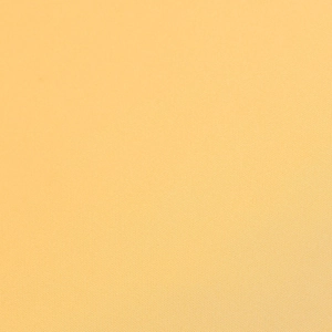 Vue macro d'un tissu satiné jaune montrant les détails de texture en sergé fin