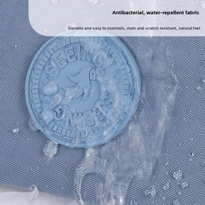 Close-up of light blue water-repellent and antibacterial nylon fabric with water drops