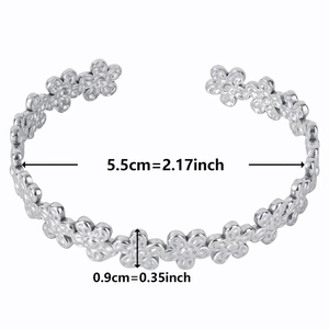 Detailed view of silver five-petal flower bangle with 5.5cm inner diameter measurements