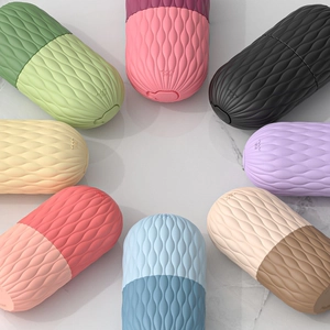 Detailed view of colorful silicone wave texture on capsule-shaped facial ice rollers