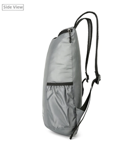 Detailed side view of grey lightweight folding backpack with ripstop nylon and mesh pocket