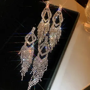 Sparkling long tassel earrings with geometric diamond-encrusted studs and silver posts