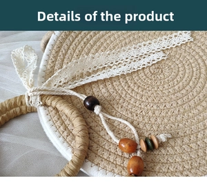 Detailed close-up of a round straw bag with woven texture, lace ribbon, and colorful wood beads