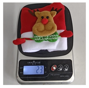 Detailed close-up of a plush reindeer Christmas hat showing its 23g lightweight material