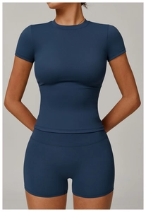 Detail of high-stretch brushed yoga set with slim-fit short sleeve top and high waist shorts