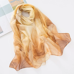 Detailed texture of brown leaf vein pattern on sheer lotus chiffon silk scarf