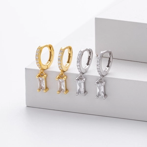 Macro shot of S925 sterling silver hoop earrings with rectangular zircon pendants
