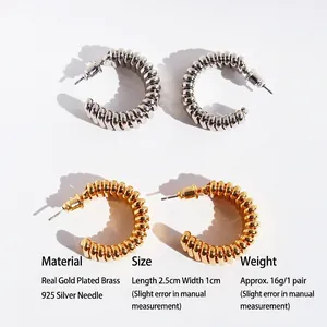 Trendy spiral wave gold and silver C-shaped chunky earrings in textured brass and 925 silver