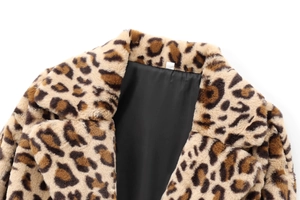 Detail of leopard print faux fur coat neckline with soft texture and black lining