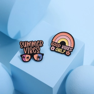 Pink sloth rainbow enamel pins with Summer Vibes and Good Vibes Only slogans on blue background