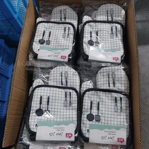 Bulk packaging of black and white checkered oven mitts and pot pads in shipping box