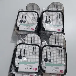 Bulk packaging of black and white checkered oven mitts and pot pads in shipping box