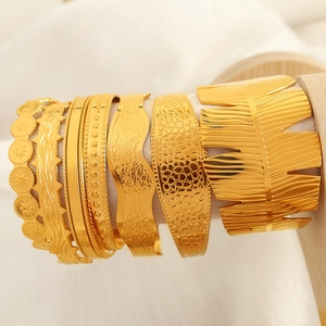 Golden stackable titanium steel cuff bracelets with assorted irregular wave textures