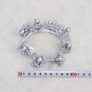Silver artificial berry wreath and leaf napkin ring for Christmas table decorations