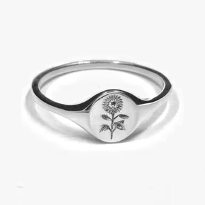 Minimalist silver sunflower signet ring featuring a finely engraved floral pattern