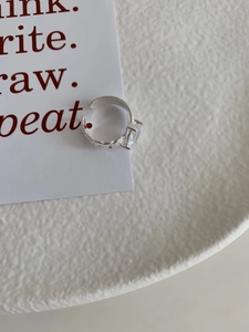 Macro view of 925 silver chain ring featuring a large rectangular zircon and open band