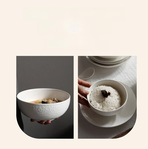 Detailed relief pattern on white ceramic dinnerware bowl with elegant floral textures