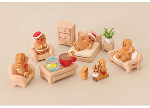 Miniature Christmas gingerbread man house scene with resin furniture and fishbowl decor