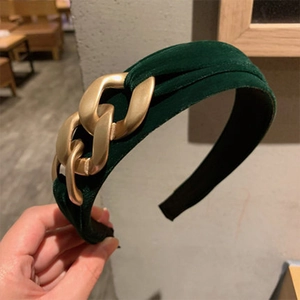 Retro dark green velvet headband featuring a decorative chunky gold chain link design