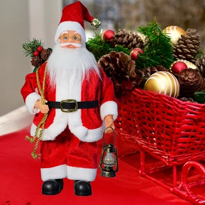 Close-up of Santa Claus figurine with golden lantern and gift bag filled with pine cones