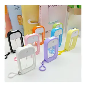 Set of eight colorful mini spray bottles with silicone protective cases and hooks